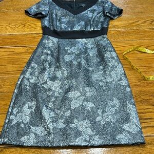 Alex Marie silver leaf foil dress with black trim. Short sleeve,V-Neck, Size 6.